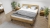 Małżeńskie łóżko drewniane dąb naturalny TORO Classic 140x200 z unikalną metalową nóżką.